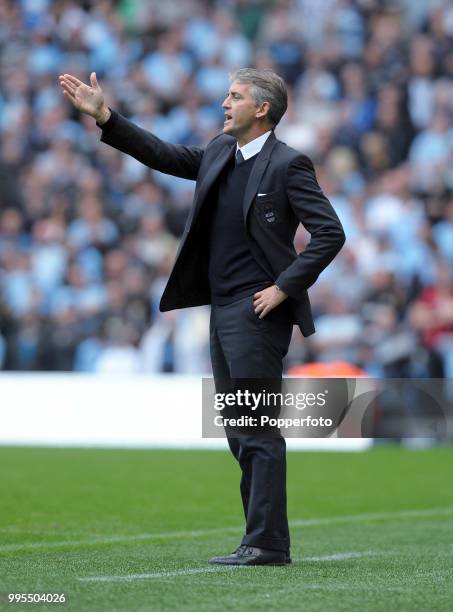 Manchester City manager Roberto Mancini gives instructions during the Barclays Premier League match between Manchester City and Blackburn Rovers at...