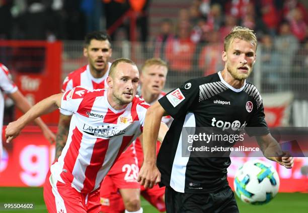Berlin's Toni Leistner and Kaiserslautern's Sebastian Andersson vie for the ball during the German 2. Bundesliga match between 1. FC Union Berlin and...