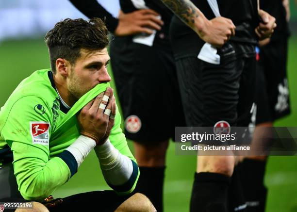 Dpatop - Kaiserslautern's goalkeeper Marius Mueller sits on the pitch after the German 2. Bundesliga match between 1. FC Union Berlin and 1. FC...