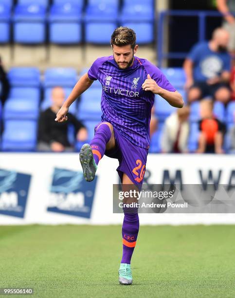 Adam Lallana of Liverpool warms up before a pre-season friendly match between Tranmere Rovers and Liverpool at Prenton Park on July 10, 2018 in...