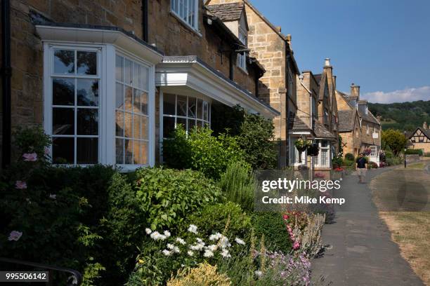 Broadway in The Cotswolds, United Kingdom. Broadway village lies beneath Fish Hill on the western Cotswold escarpment. The broad way is the wide...