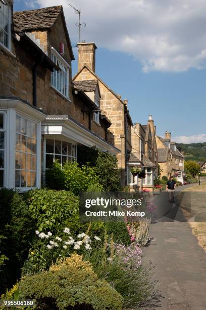 Broadway in The Cotswolds, United Kingdom. Broadway village lies beneath Fish Hill on the western Cotswold escarpment. The broad way is the wide...