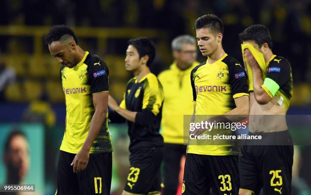 Dortmund's Pierre-Emerick Aubameyang , Shinji Kagawa, Julian Weigl and Sokratis leave the field after the UEFA Champions League football match...