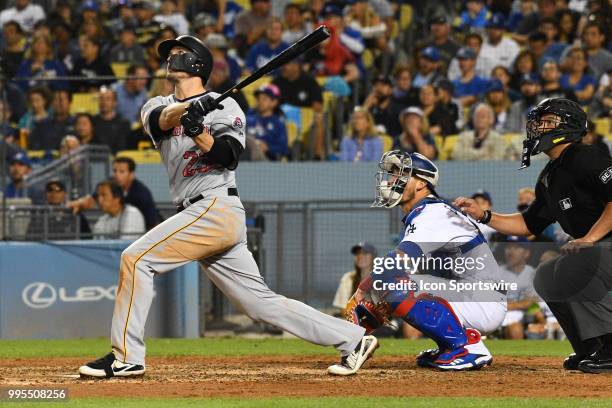 Pittsburgh Pirates infielder David Freese hits a home run during a MLB game between the Los Angeles Dodgers and the Los Angeles Angels of Anaheim on...