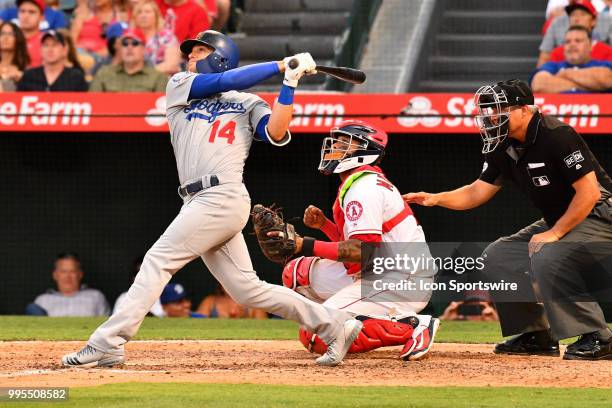 Los Angeles Dodgers outfielder Enrique Hernandez hits a deep fly ball during a MLB game between the Los Angeles Dodgers and the Los Angeles Angels of...