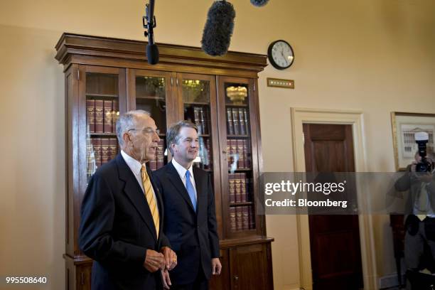 Senator Chuck Grassley, a Republican from Iowa and chairman of the Senate Judiciary Committee, left, speaks as Brett Kavanaugh, U.S. Supreme Court...