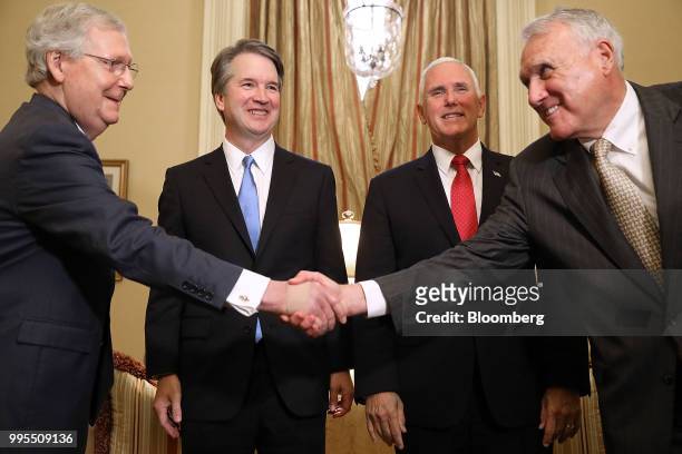 Senate Majority Leader Mitch McConnell, a Republican from Kentucky, left, shakes hands with former Senator Jon Kyl, a Republican from Arizona, during...