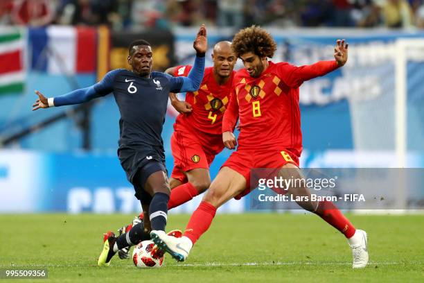 Marouane Fellaini of Belgium tackles Paul Pogba of France during the 2018 FIFA World Cup Russia Semi Final match between Belgium and France at Saint...