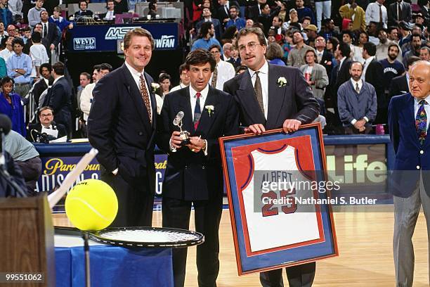 Marv Albert is presented a jersey by Ernie Grunfeld for 25 years of broadcasting circa 1991 at Madison Square Garden in New York, New York NOTE TO...