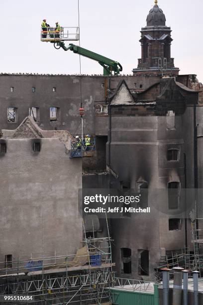 Workers begin the demolition of the burnt-out Glasgow Art School on July 10, 2018 in Glasgow, Scotland. The grade A listed building was undergoing a...