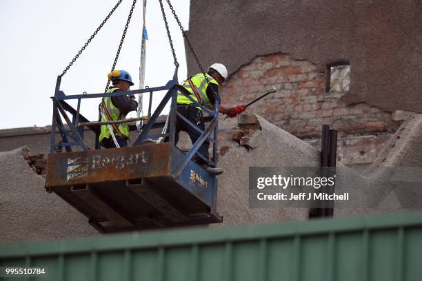 Workers begin the demolition of the burnt-out Glasgow Art School on July 10, 2018 in Glasgow, Scotland. The grade A listed building was undergoing a...