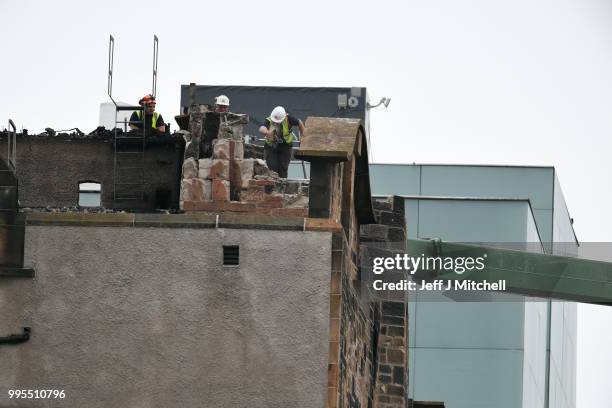 Workers begin the demolition of the burnt-out Glasgow Art School on July 10, 2018 in Glasgow, Scotland. The grade A listed building was undergoing a...