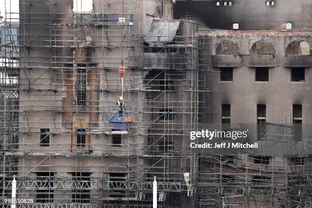 Workers begin the demolition of the burnt-out Glasgow Art School on July 10, 2018 in Glasgow, Scotland. The grade A listed building was undergoing a...