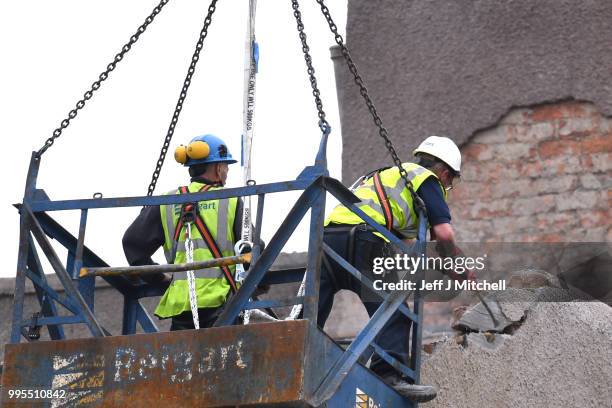 Workers begin the demolition of the burnt-out Glasgow Art School on July 10, 2018 in Glasgow, Scotland. The grade A listed building was undergoing a...