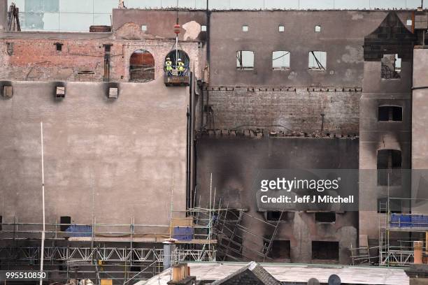 Workers begin the demolition of the burnt-out Glasgow Art School on July 10, 2018 in Glasgow, Scotland. The grade A listed building was undergoing a...