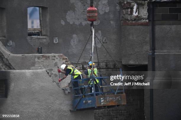 Workers begin the demolition of the burnt-out Glasgow Art School on July 10, 2018 in Glasgow, Scotland. The grade A listed building was undergoing a...