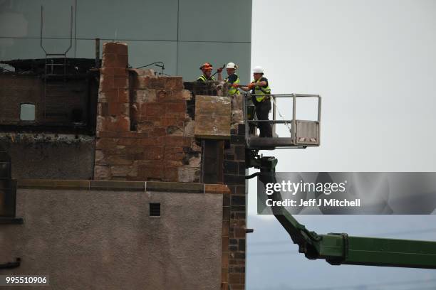 Workers begin the demolition of the burnt-out Glasgow Art School on July 10, 2018 in Glasgow, Scotland. The grade A listed building was undergoing a...