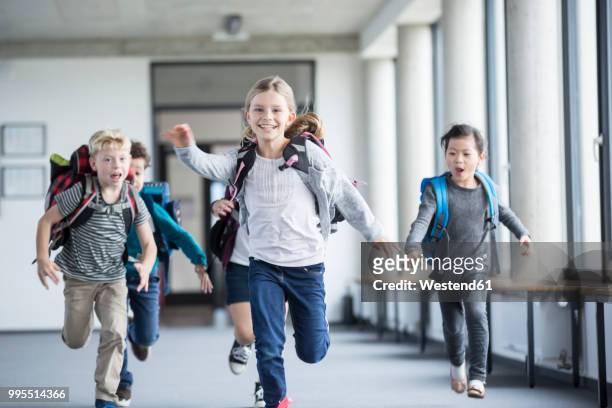 excited pupils rushing down school corridor - children only stock pictures, royalty-free photos & images
