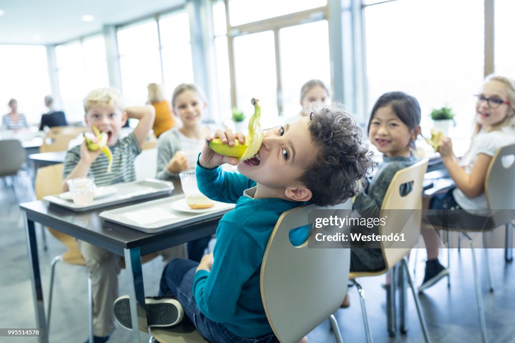 Pupils having lunch in school canteen
