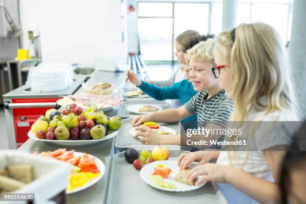 pupils at counter in school canteen - mitt på dagen bildbanksfoton och bilder