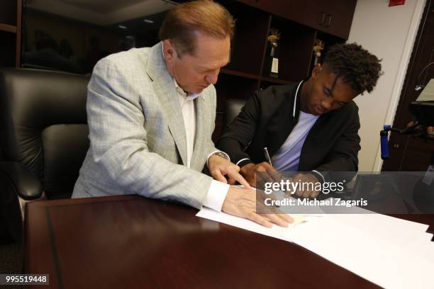 Agent Scott Boras watches as first round draft pick Kyler Murray of the Oakland Athletics signs his contract at the Oakland Alameda Coliseum on June...