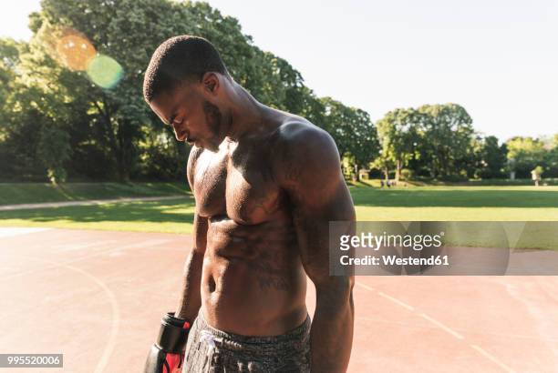 young afro-american man training boxing on sports field, outdoors - athlete defeat stock pictures, royalty-free photos & images