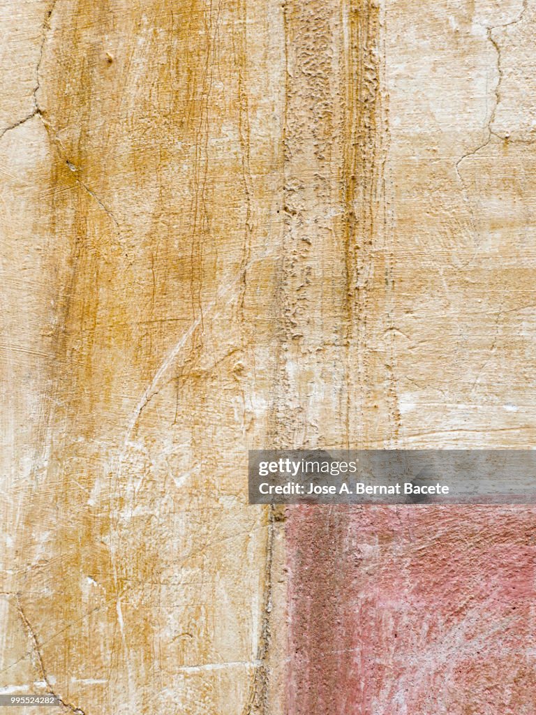 Complete setting of a facade of a cement wall ancient and with cracks. High resolution photography.