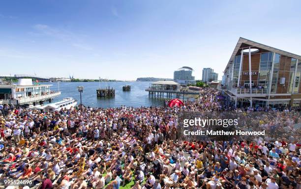 Football fans watch the World Cup quarter-final match between England and Sweden on a big screen at Mermaid Quay, Cardiff Bay, on July 07, 2018 in...