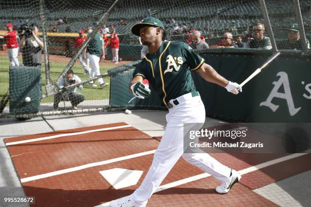 First round draft pick Kyler Murray of the Oakland Athletics takes batting practice after signing his contract at the Oakland Alameda Coliseum on...