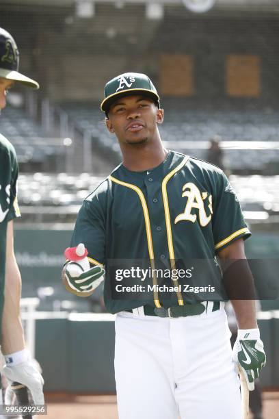 First round draft pick Kyler Murray of the Oakland Athletics stands on the field after signing his contract at the Oakland Alameda Coliseum on June...