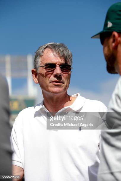 Executive Vice President of Baseball Operations Billy Beane of the Oakland Athletics stands on the field after first round draft pick Kyler Murray...
