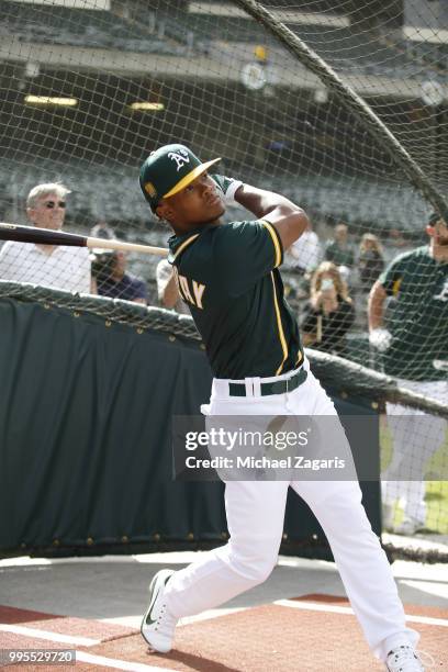 First round draft pick Kyler Murray of the Oakland Athletics takes batting practice after signing his contract at the Oakland Alameda Coliseum on...