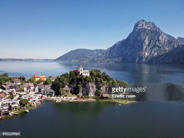 aerial view of traunkirchen church on traunsee lake, in salzkammergut, upper austria - gmunden austria stock pictures, royalty-free photos & images