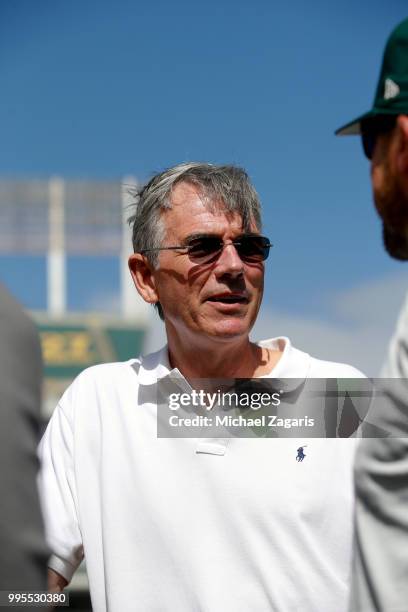 Executive Vice President of Baseball Operations Billy Beane of the Oakland Athletics stands on the field after first round draft pick Kyler Murray...