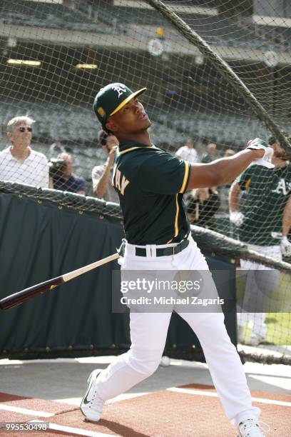 First round draft pick Kyler Murray of the Oakland Athletics takes batting practice after signing his contract at the Oakland Alameda Coliseum on...