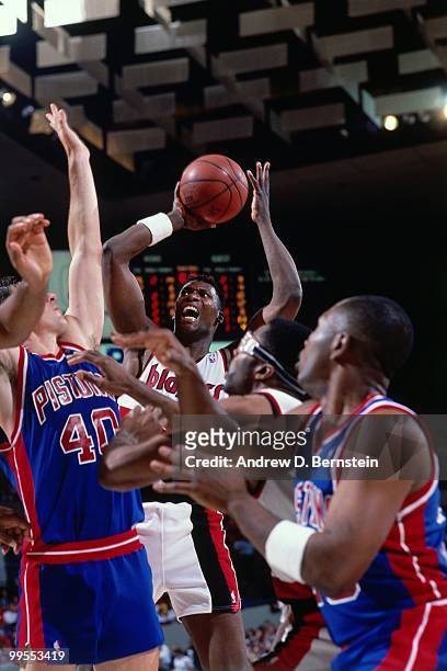 Jerome Kersey of the Portland Trail Blazers shoots against Bill Laimbeer of the Detroit Pistons during Game Five of the 1990 NBA Finals on June 14,...