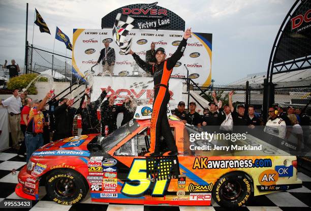 Aric Almirola, driver of the Graceway Pharm/AKawareness.com Toyota, celebrates in Victory Lane after winning the NASCAR Camping World Truck Series...