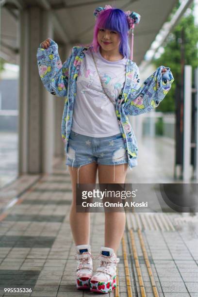 Ichigo Sky is wearing a Power Puff Girls zip hoodie by ACDC Rag, T-shirt by Listen Flavour, Ripped denim shorts by Dolls Kill, platform strawberry...