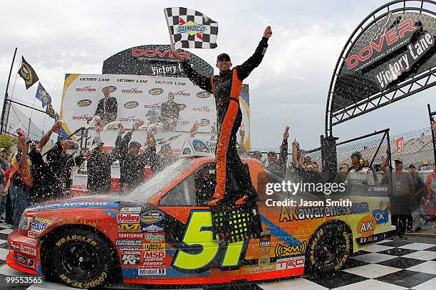 Aric Almirola, driver of the Graceway Pharm/AKawareness.com Toyota, celebrates in Victory Lane after winning the NASCAR Camping World Truck Series...