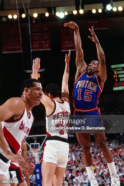 Vinnie Johnson of the Detroit Pistons shoots against Drazen Petrovic of the Portland Trail Blazers during the 1990 NBA Finals at the Memorial...