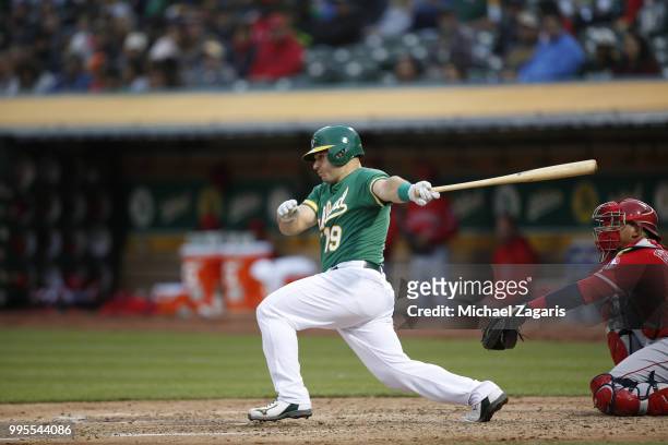 Josh Phegley of the Oakland Athletics bats during the game against the Los Angeles Angels of Anaheim at the Oakland Alameda Coliseum on June 15, 2018...