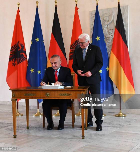 German president Frank-Walter Steinmeier stands next to the President of Albania Ilir Meta as he signs the guestbook in Berlin, Germany, 26 September...