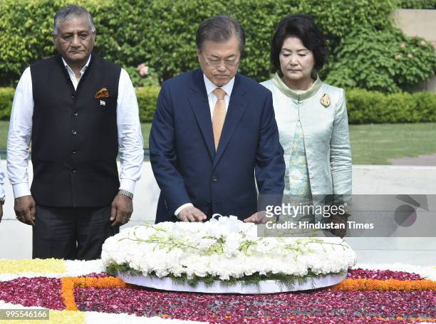 South Korean President Moon Jae-in and his wife Kim Jung-sook pay homage to Mahatma Gandhi at his memorial Rajghat, on July 10, 2018 in New Delhi,...