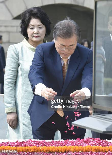 South Korean President Moon Jae-in and his wife Kim Jung-sook pay homage to Mahatma Gandhi at his memorial Rajghat, on July 10, 2018 in New Delhi,...