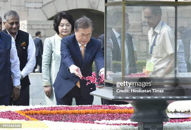 South Korean President Moon Jae-in and his wife Kim Jung-sook pay homage to Mahatma Gandhi at his memorial Rajghat, on July 10, 2018 in New Delhi,...