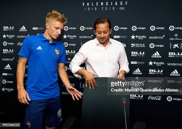 Anil Murthy president of Valencia CF and Daniel Wass during his presentation as a new player for Valencia CF at Paterna Training Centre on July 10,...