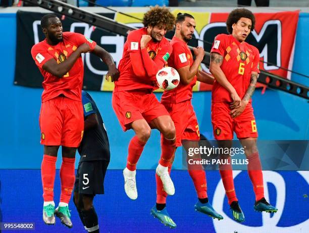 Belgium's forward Romelu Lukaku, Belgium's midfielder Marouane Fellaini, Belgium's midfielder Nacer Chadli and Belgium's midfielder Axel Witsel jump...