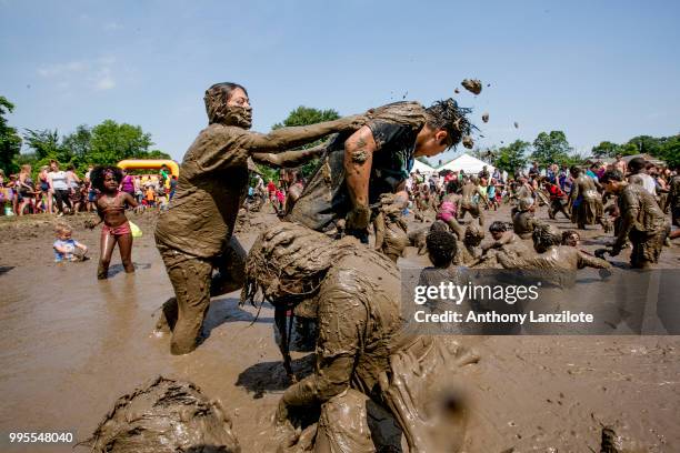 Children play in the mud at Mud Day at Nankin Mills Park on July 10, 2018 in Westland, Michigan. The event has taken place for the past 31 summers...