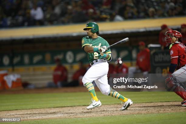 Khris Davis of the Oakland Athletics bats during the game against the Los Angeles Angels of Anaheim at the Oakland Alameda Coliseum on June 15, 2018...