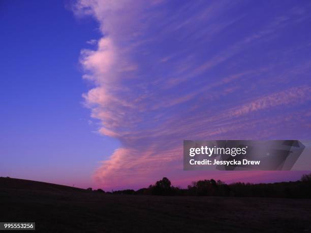 cotton candy sweeping clouds - sweeping landscape stock pictures, royalty-free photos & images